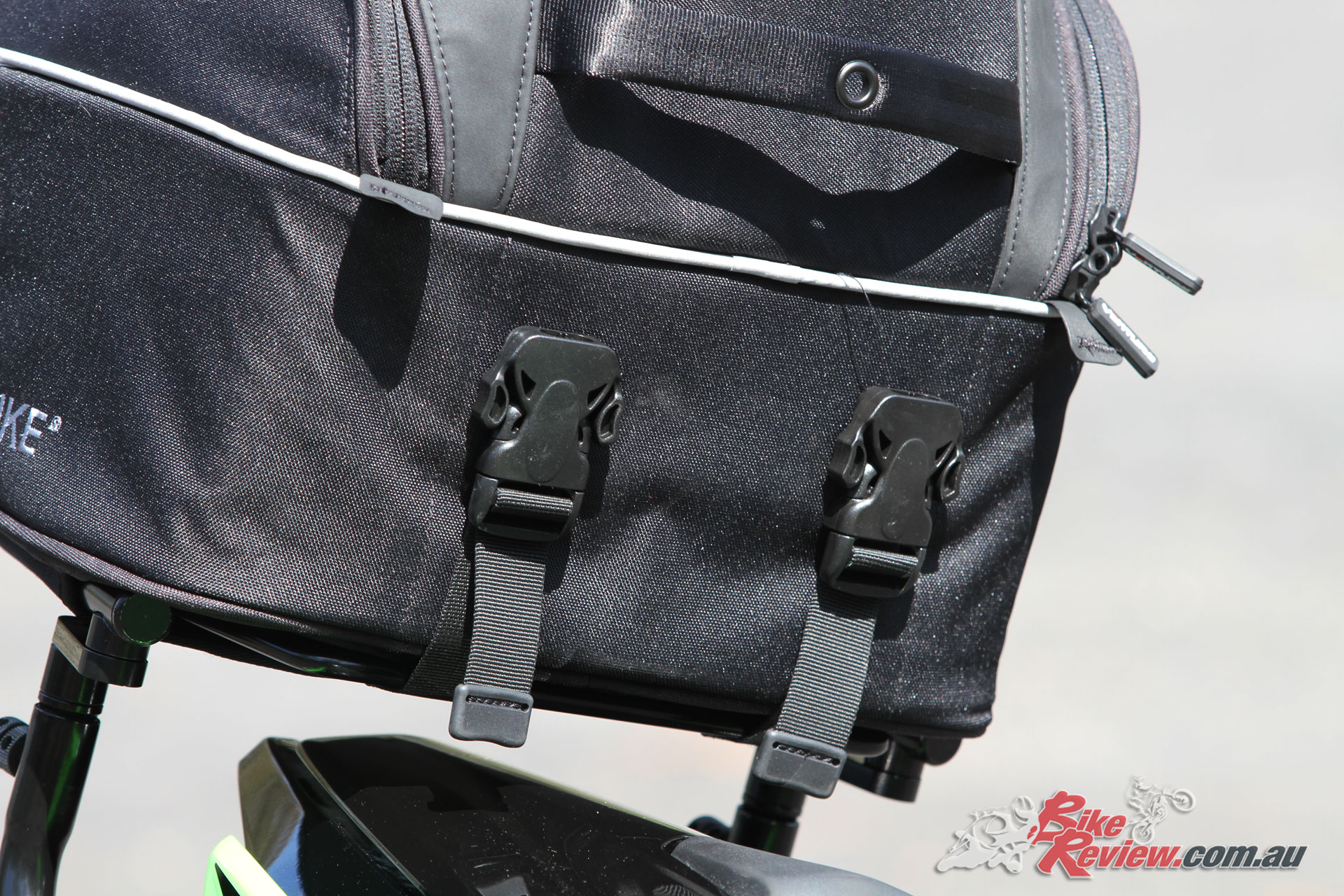These quick release buckles are seriously heavy duty, meaning the bag won't be coming loose if secured properly, but requires a bit of strength to release.